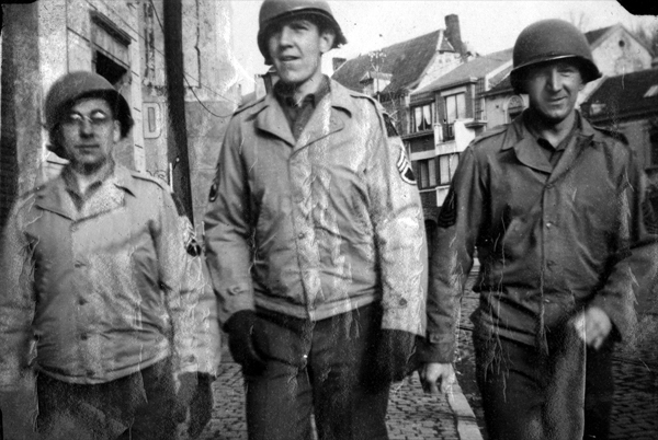 Photo of Sergeants Andrews, Landers, and Crawford 14th Chemical Maintenance Company, in their WW-II U.S. Army uniforms, taken Winter 1944-45, Ensival, Belgium